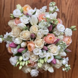 Bouquet of white and peach roses with pink tulips