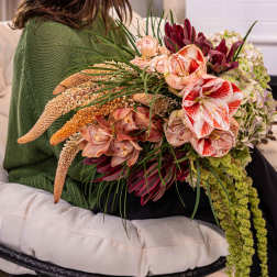 Large bouquet with red-and-white amaryllis and pale orchids