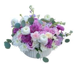 Pink and white mixed flower arrangement in a white vase