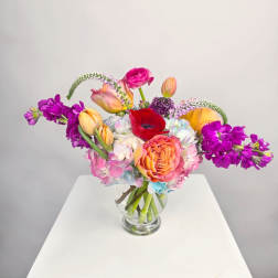 Colorful mixed bouquet in a clear glass vase