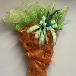 Orange and green mesh carrot-shaped wall decoration with ribbon bow