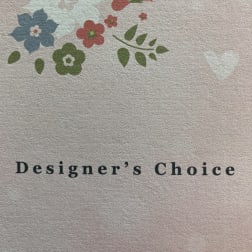 Designer’s Choice text with a small floral logo above it