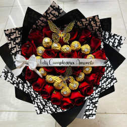 Bouquet of red roses with gold-wrapped chocolates and a white ribbon