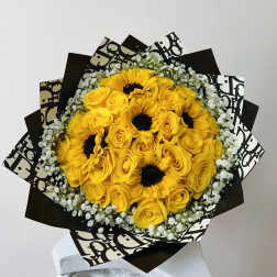 Yellow roses and sunflowers in black-and-white wrapping