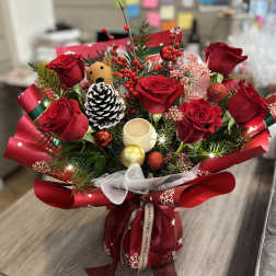 Red rose bouquet with Christmas ornaments and ribbon wrap