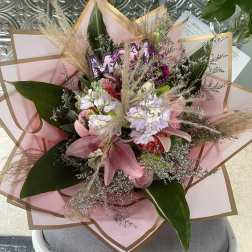 Pink and white mixed bouquet wrapped in blush paper