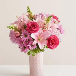 Pink and lavender bouquet in a tall pink vase