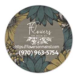 Round floral shop sign with sunflower artwork and store name