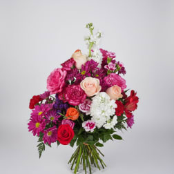 Mixed bouquet of pink, white, and red flowers