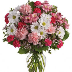 Pink and white mixed bouquet in a clear glass vase