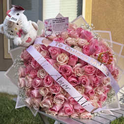 Large pink rose bouquet with a Hello Kitty plush and ribbons