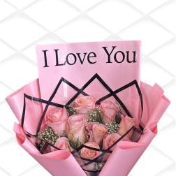 Pink rose bouquet wrapped with a "I Love You" card and black ribbon
