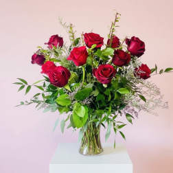 Bouquet of red roses in a clear glass vase