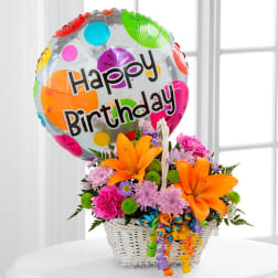Birthday balloon with a colorful flower basket arrangement