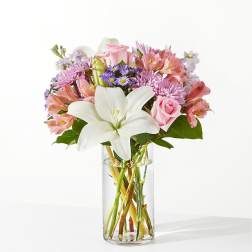 Pink and white mixed bouquet in a clear glass vase