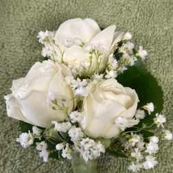 White rose and calla lily boutonniere with baby's breath