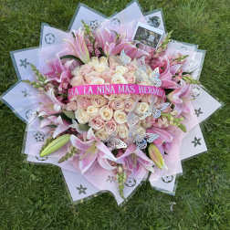 Pink and cream rose bouquet with lilies and butterfly accents