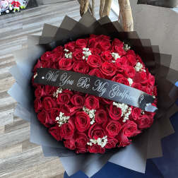 Bouquet of red roses with a black ribbon banner