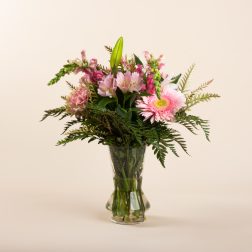 Pink mixed bouquet in a clear glass vase
