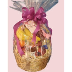 Gift basket wrapped in clear cellophane with a purple bow