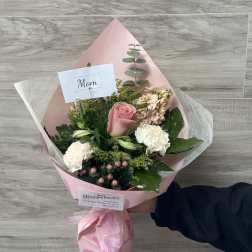 Pink rose bouquet with white carnations and a Mom card