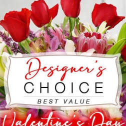 Mixed bouquet with red roses and pink orchids, labeled Designer's Choice.