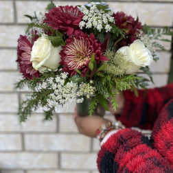 Bouquet of burgundy and white flowers with greenery