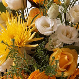 Bouquet of yellow and white flowers with orange roses