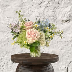 Mixed pastel bouquet in a clear glass vase