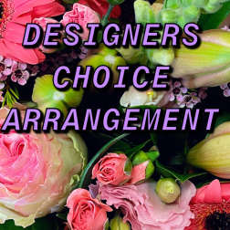 Mixed bouquet with pink gerbera daisies, roses, lilies, and small blossoms