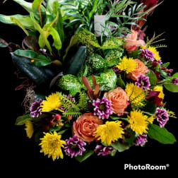 Mixed bouquet with peach roses, yellow mums, and purple daisies