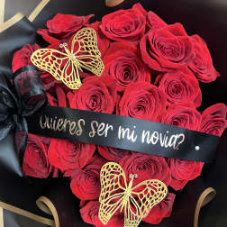 Red rose bouquet with black ribbon and gold butterfly decorations