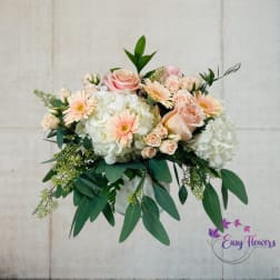 Bouquet of pale pink roses, white hydrangeas, and peach gerbera daisies