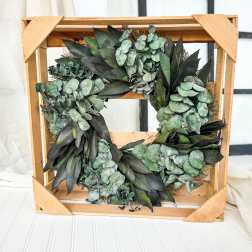 Eucalyptus wreath on a wooden crate frame