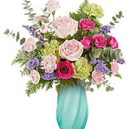 Pink and white rose bouquet in a turquoise vase