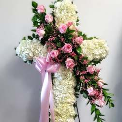 Cross-shaped floral standing spray with pink roses and white hydrangeas