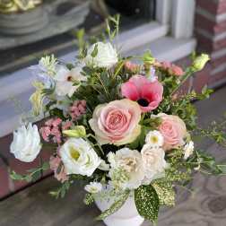 Pink and white mixed bouquet in a white vase