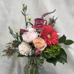 Mixed bouquet in a glass vase with a pink "#1 Mom" pick