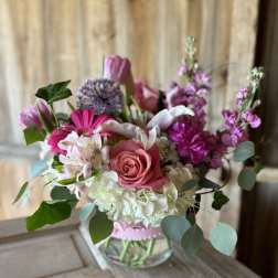 Pink and white mixed bouquet in a clear glass vase
