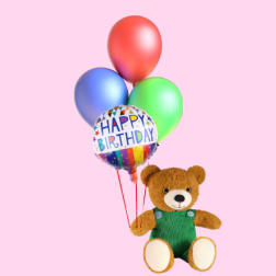 Teddy bear holding birthday balloons on a pink background