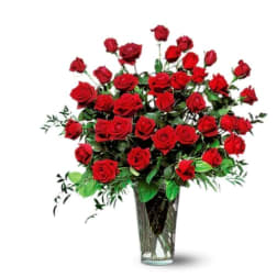 Bouquet of red roses in a clear glass vase