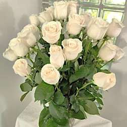 Bouquet of white roses with green foliage