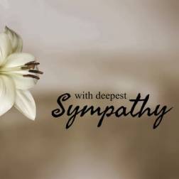 White lilies beside sympathy text on a beige card