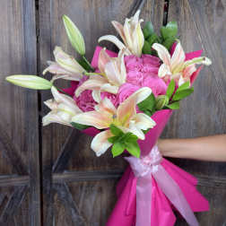 Pink rose bouquet with white lilies wrapped in bright pink paper
