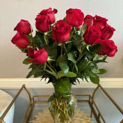 Bouquet of red roses in a clear glass vase