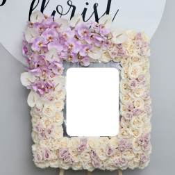 Floral standing frame with pink orchids, cream roses, and white anthuriums