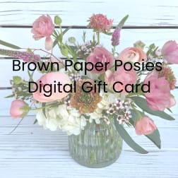 Pink and white mixed flower arrangement in a glass vase