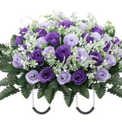 Purple and lavender rose arrangement with white filler flowers in a casket spray