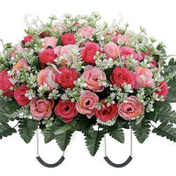 Pink rose casket spray with white filler flowers and greenery