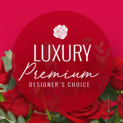 Red roses with a "Luxury Premium Designer's Choice" label